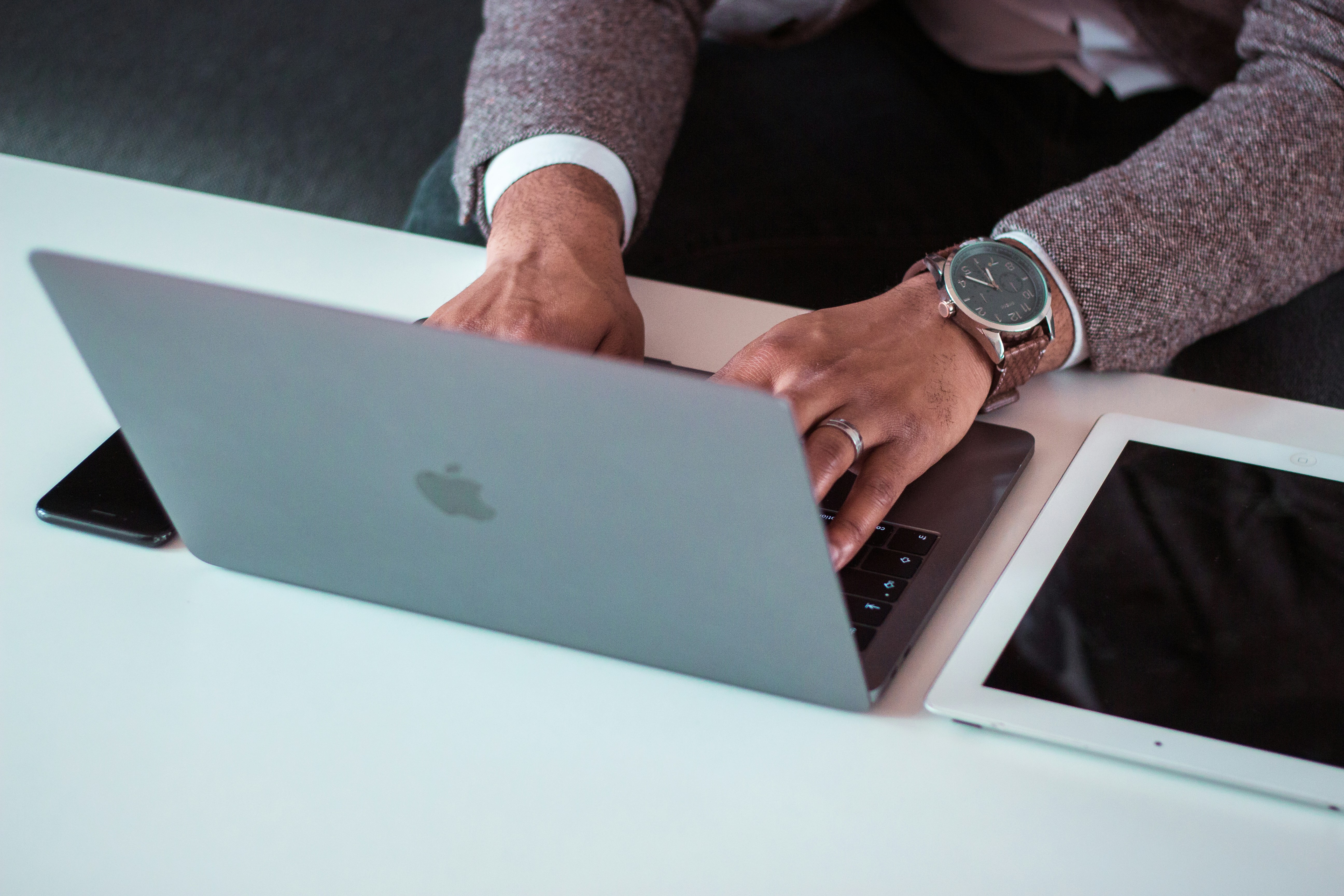 person typing on laptop - IP Address Reputation