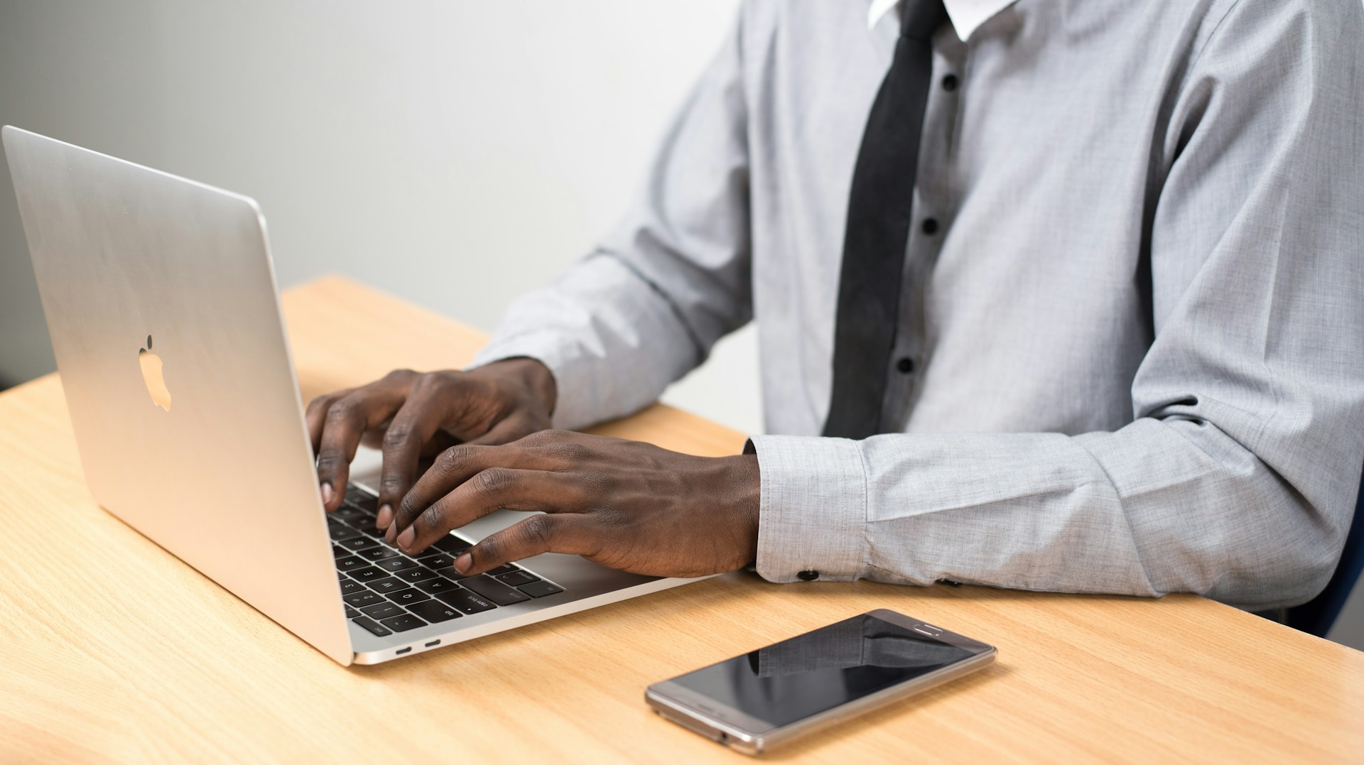 man typing email - Partnership Email Template