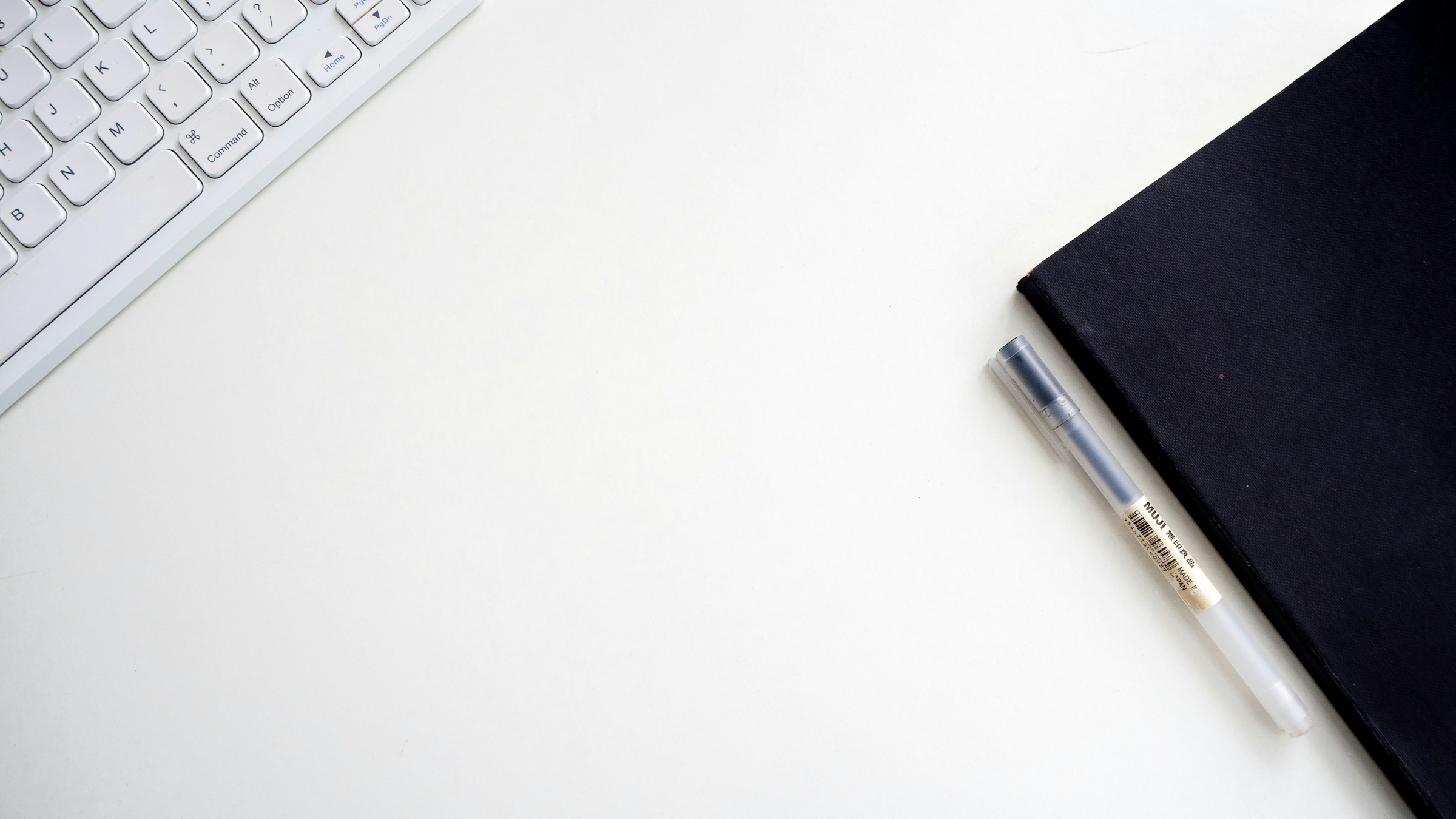 notepad and keyboard - How Many Cold Emails Per Day
