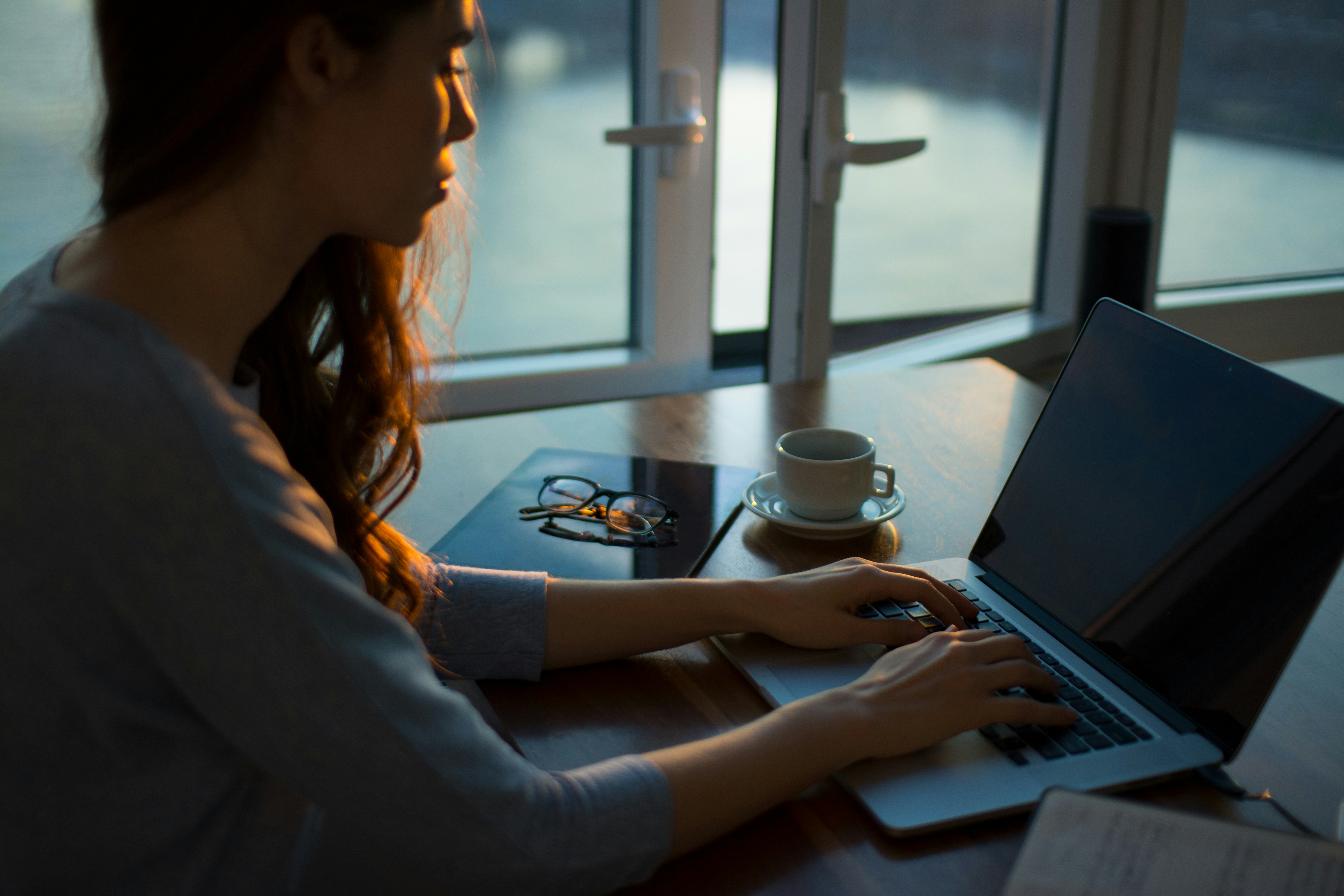 woman writing - Cold Email Services