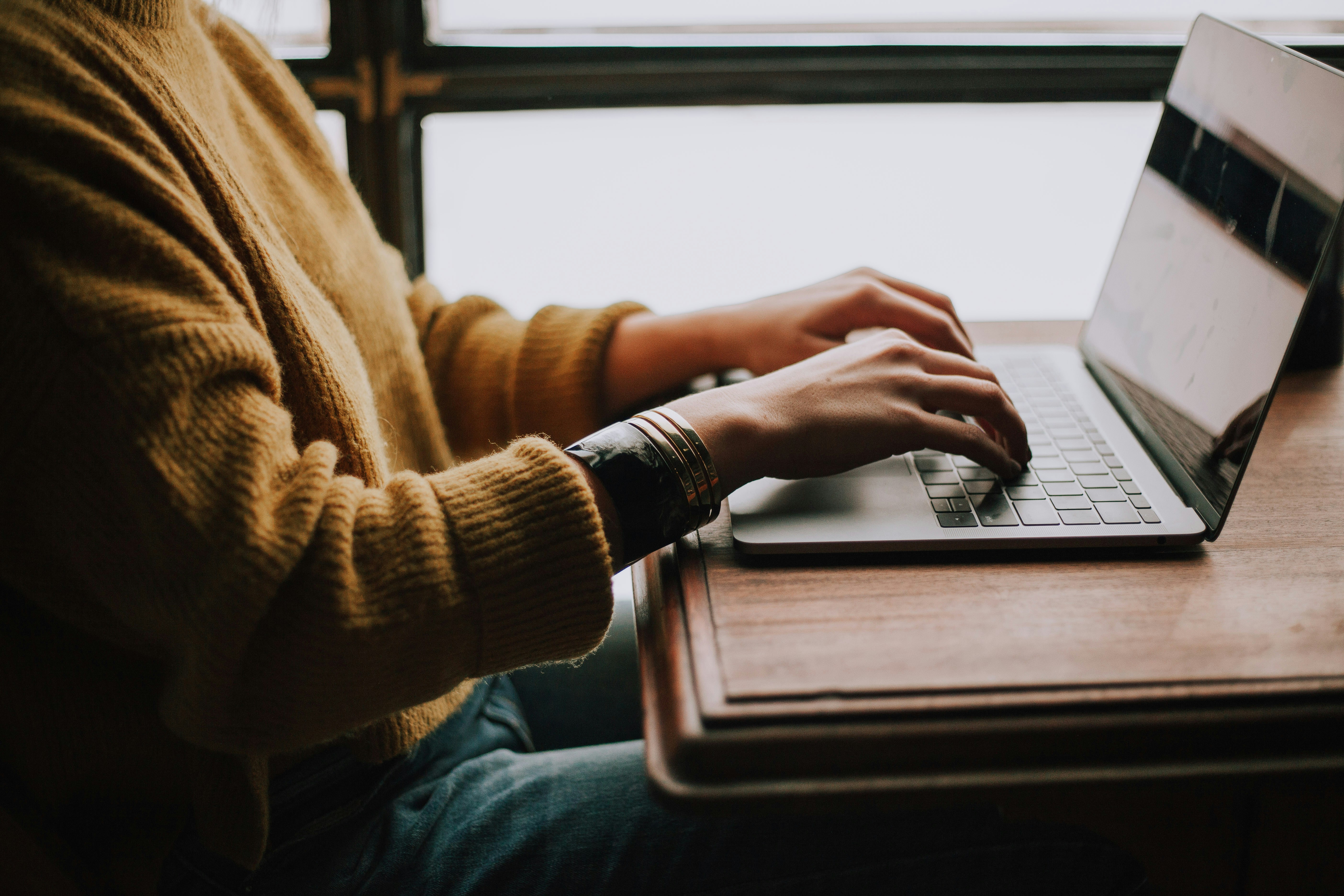 person typing on laptop - Nurture Email Sequence