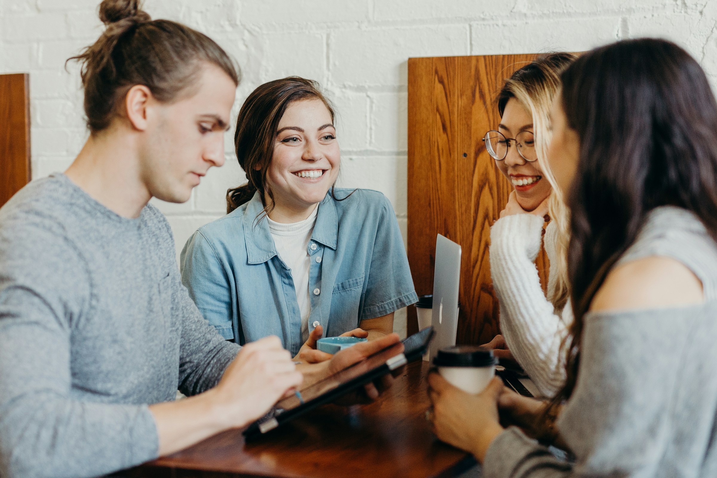 team looking on tablet - How to Improve IP Reputation