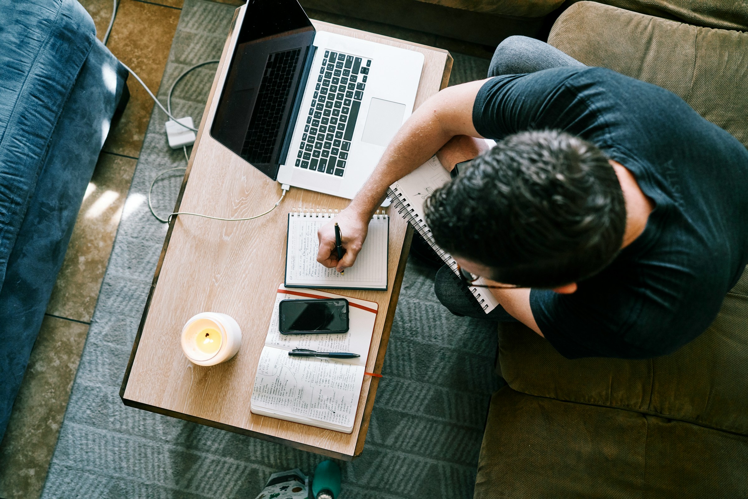 man making notes - Sales Email Automation Tools
