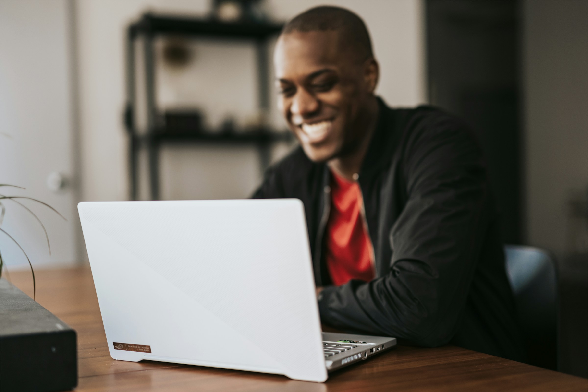 man smiling on laptop - How to Cold Email