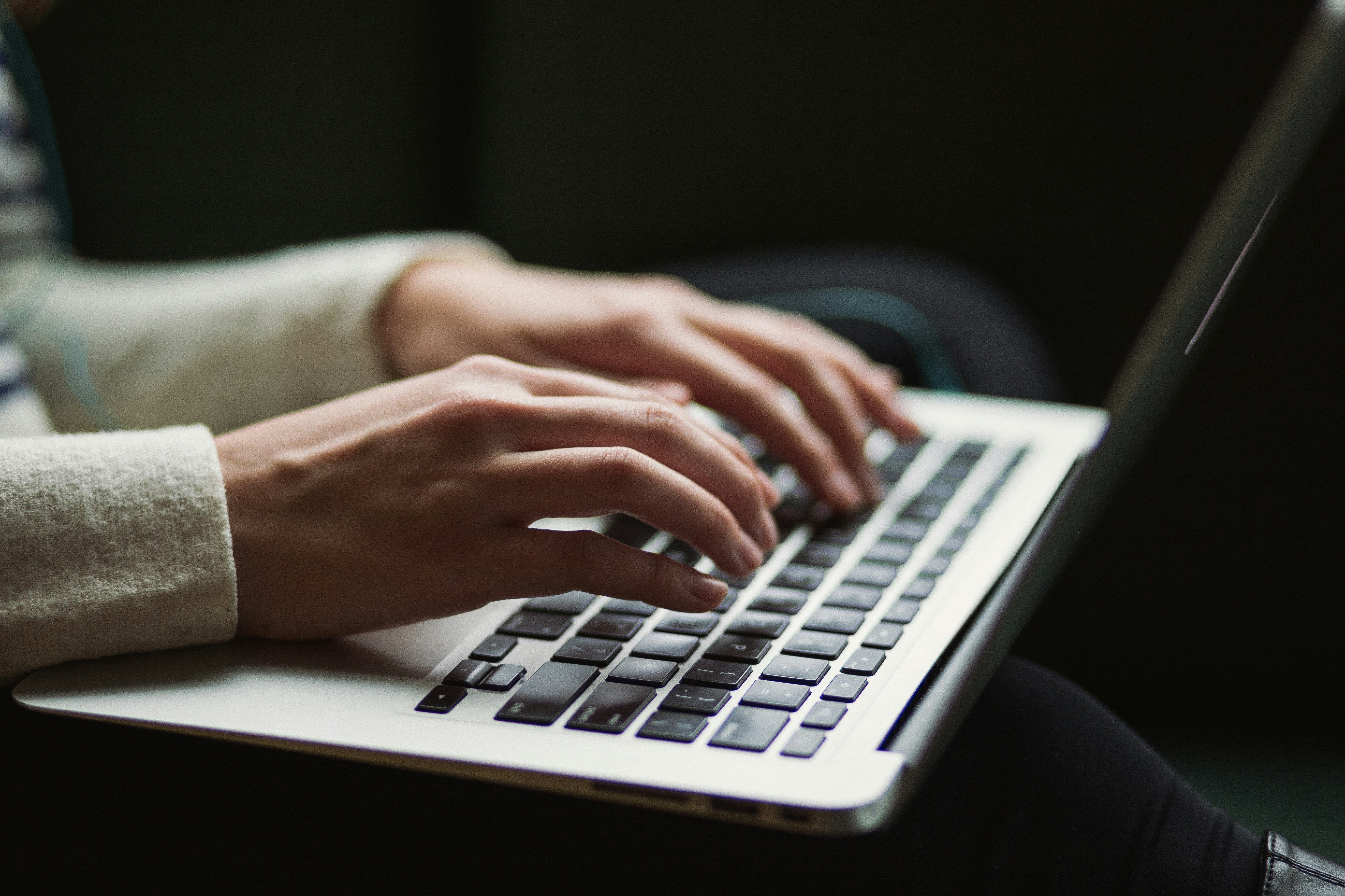 person typing on laptop - Improve Sender Reputation