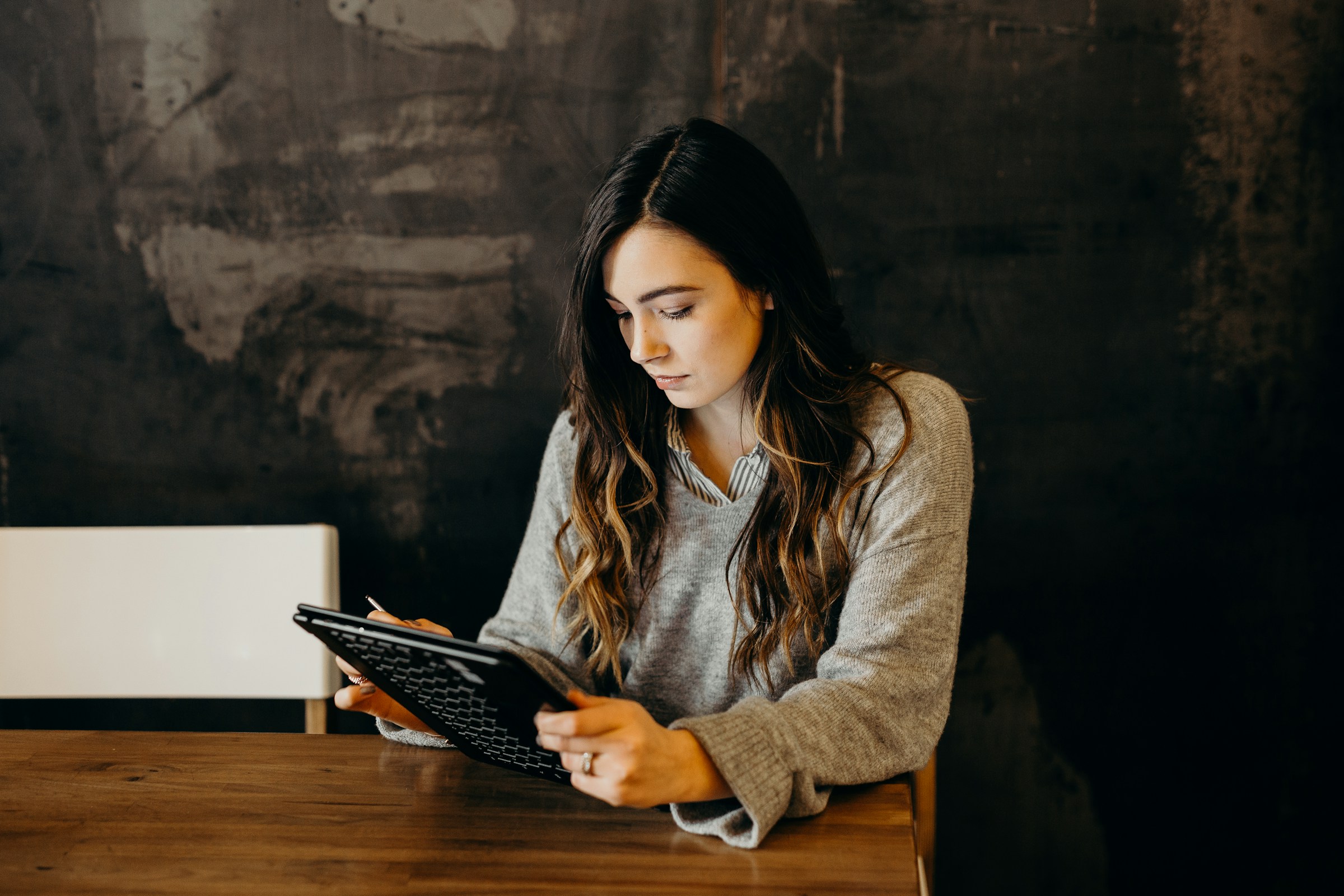 woman using tablet - Cold Email Outreach Strategy